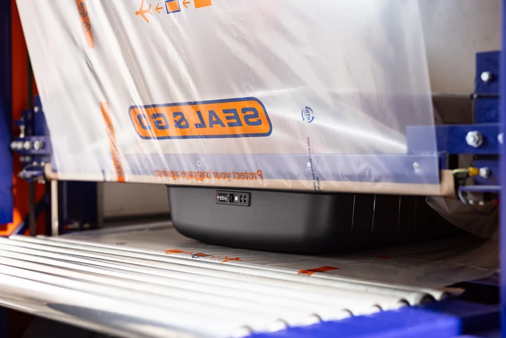 Seal and Go suitcase in machine